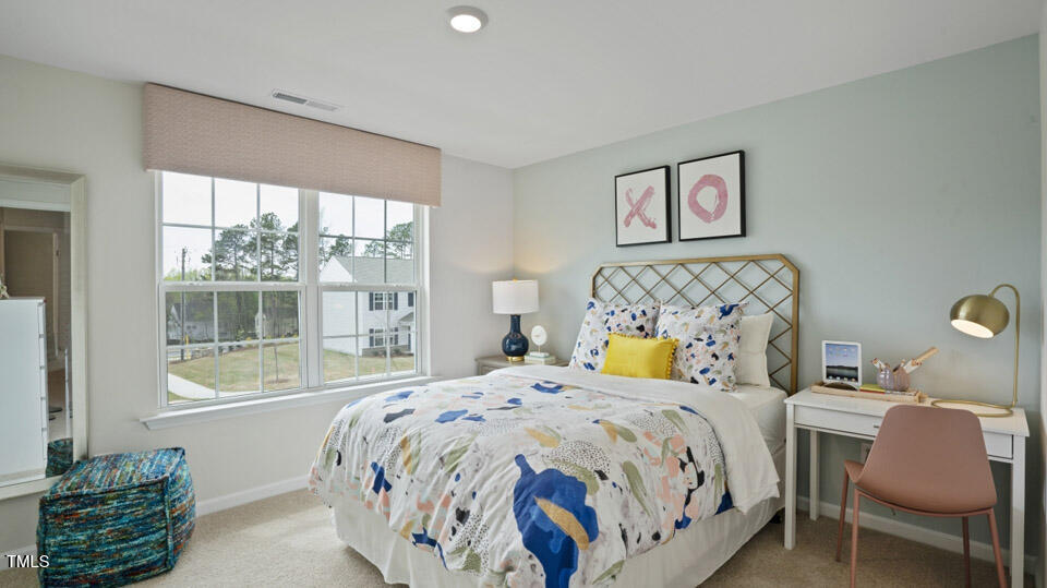 121 Daniel Road Wilson's Mills, NC 27577 - Photo 22 of 38 a bedroom with a bed and a window