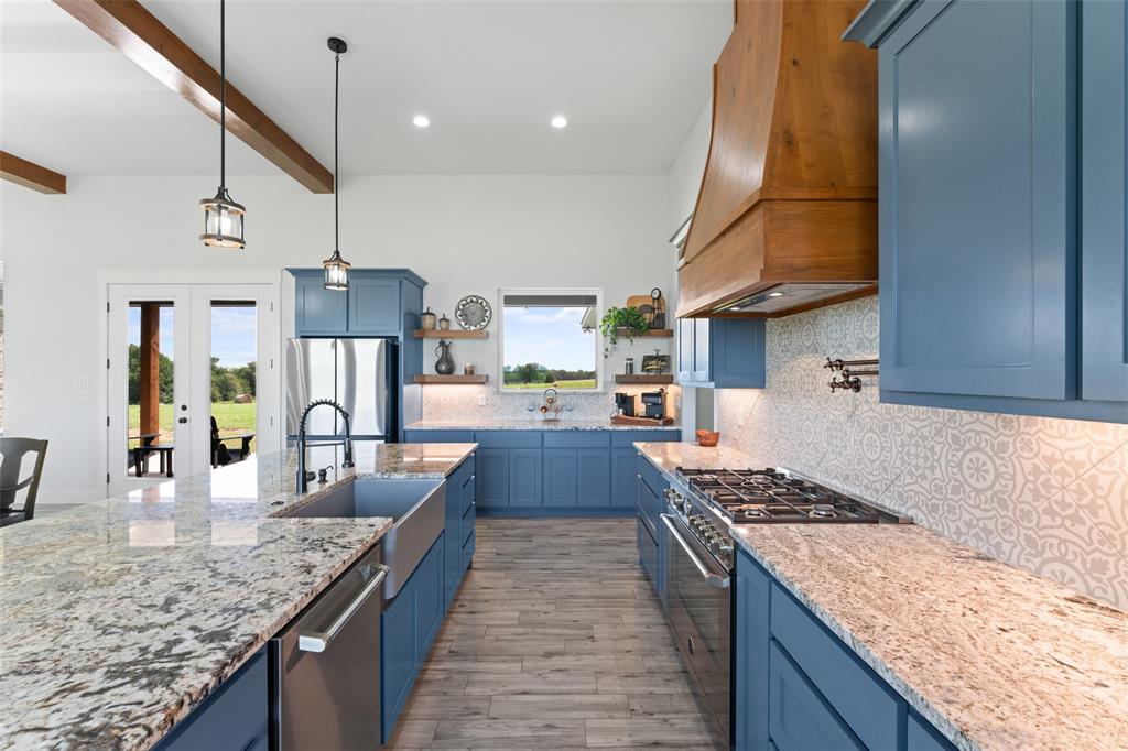4411 Fm 751 Wills Point Wills Point, TX 75169 - Photo 2 of 40 a kitchen with stainless steel appliances granite countertop a sink stove and refrigerator