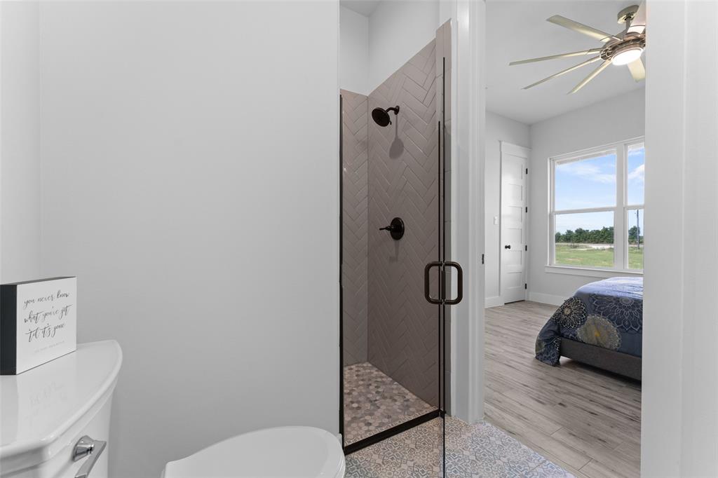 4411 Fm 751 Wills Point Wills Point, TX 75169 - Photo 33 of 40 a spacious bathroom with a toilet and a shower