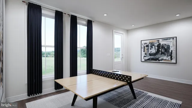 a view of a room with furniture wooden floor and window