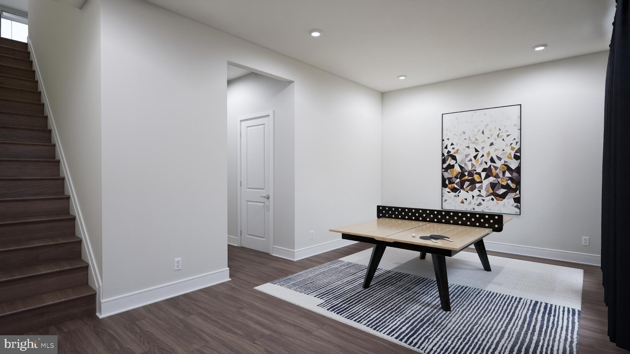 9759 Grant Avenue Manassas, VA 20110 - Photo 20 of 32 a view of a hallway with wooden floor and a bathroom