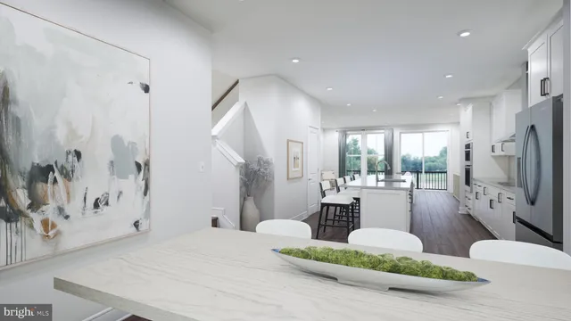 a living room with hard wood floors and a fireplace