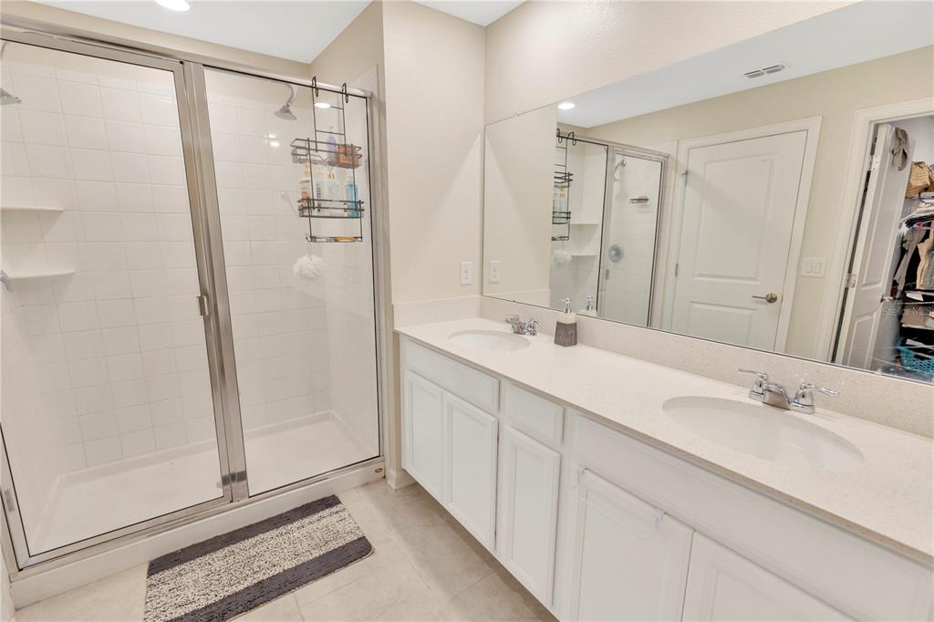 530 Patton Loop Bartow, FL 33830 - Photo 32 of 39 a bathroom with a double vanity sink mirror and shower