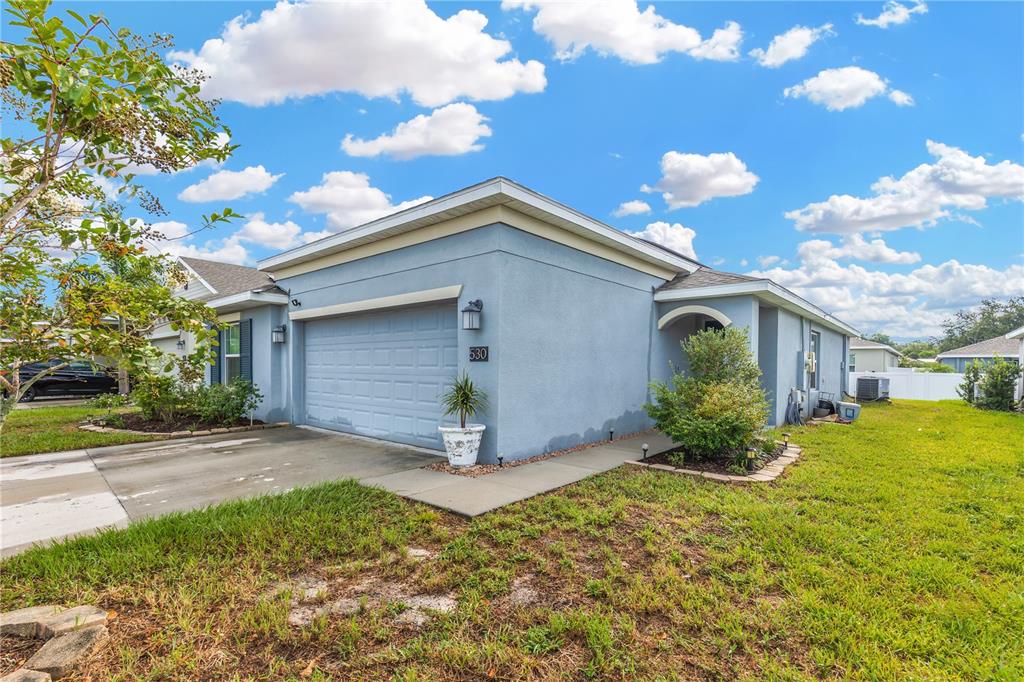 530 Patton Loop Bartow, FL 33830 - Photo 4 of 39 a view of a house with a yard