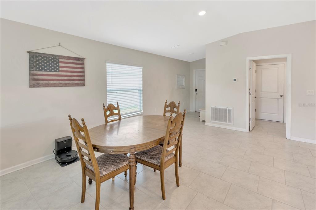 530 Patton Loop Bartow, FL 33830 - Photo 10 of 39 a view of a dining room with furniture and a chandelier