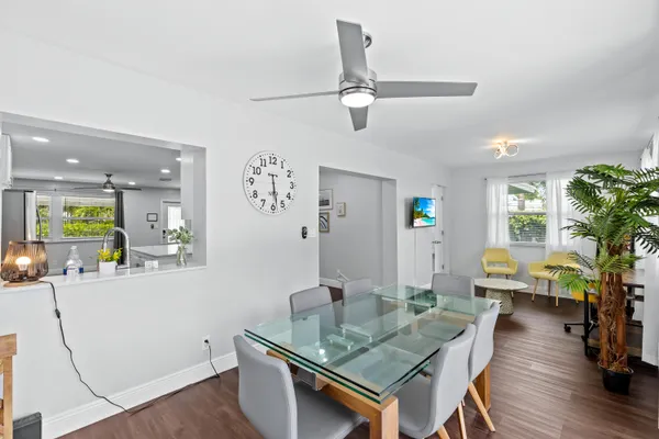 a living room with furniture a rug and a chandelier