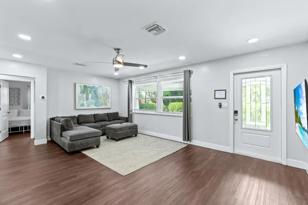 a living room with furniture and a window