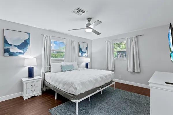 a bedroom with a bed and a dresser
