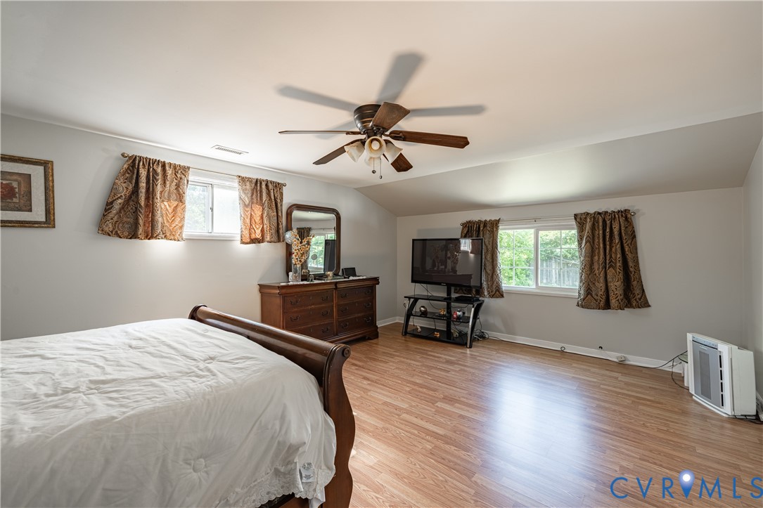 9217 Fisk Road Richmond, VA 23229 - Photo 25 of 39 a bedroom with furniture and a window
