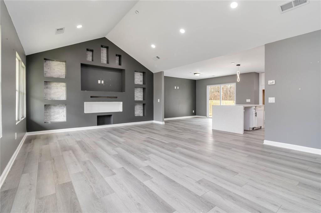 292 Natchez Circle Winder, GA 30680 - Photo 3 of 29 a view of a kitchen with a sink and a refrigerator