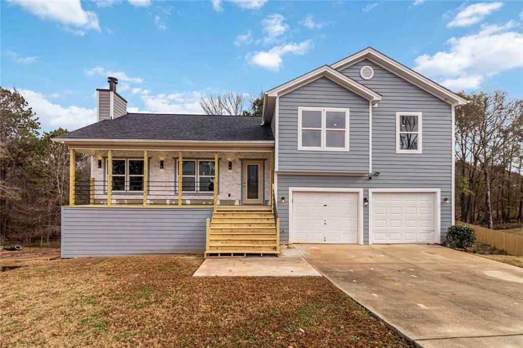 292 Natchez Circle Winder, GA 30680 - Photo 6 of 29 a front view of a house with a yard and garage