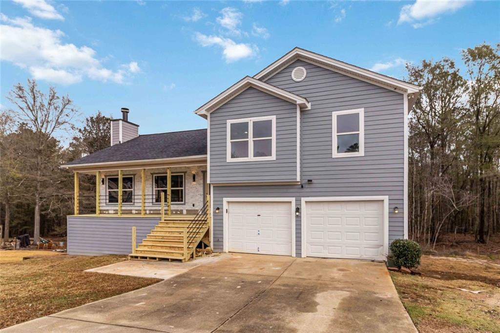 292 Natchez Circle Winder, GA 30680 - Photo 7 of 29 a view of a house with a yard and garage