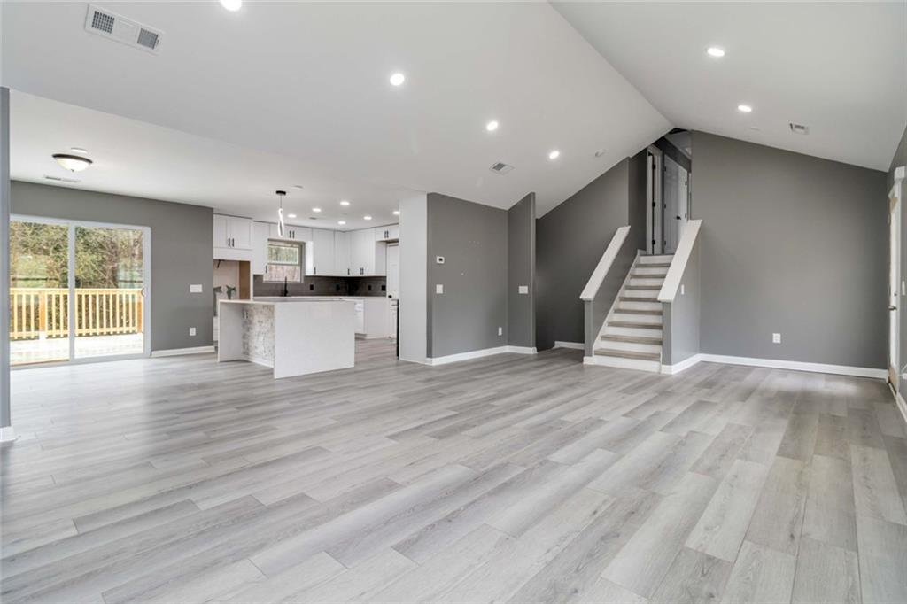 292 Natchez Circle Winder, GA 30680 - Photo 8 of 29 a view of a kitchen with a sink and a refrigerator