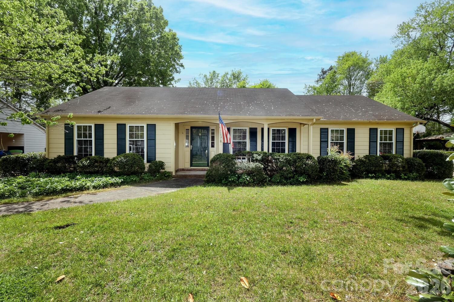 2000 Lawton Bluff Road Charlotte, NC 28226 - Photo 1 of 40 a front view of a house with a yard