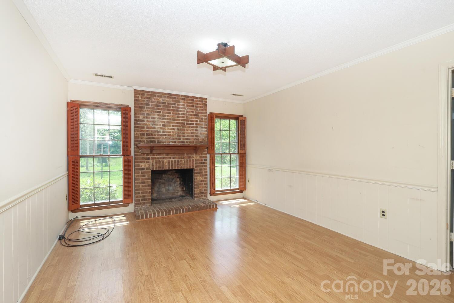 2000 Lawton Bluff Road Charlotte, NC 28226 - Photo 14 of 40 an empty room with windows and fireplace
