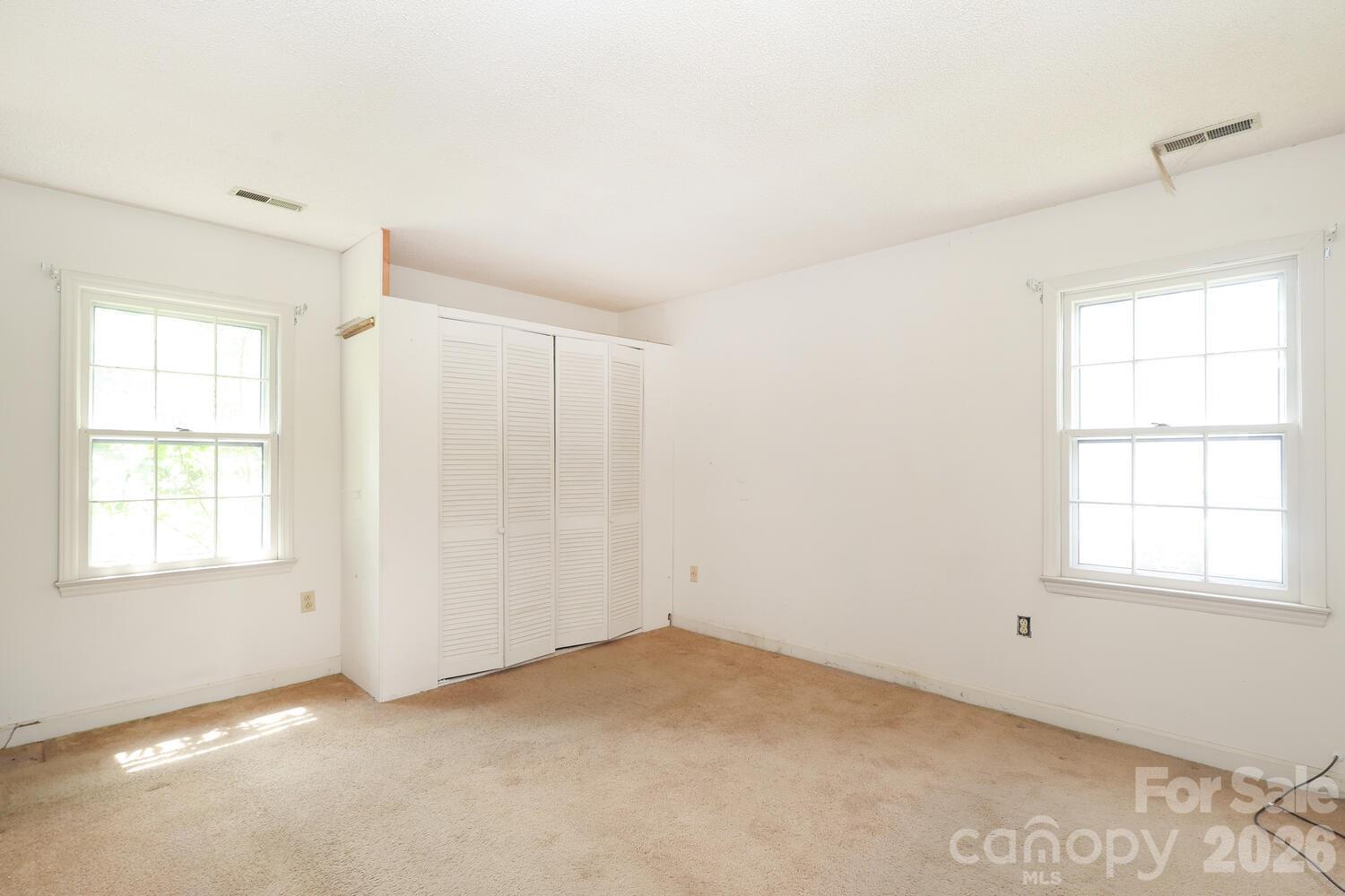 2000 Lawton Bluff Road Charlotte, NC 28226 - Photo 18 of 40 an empty room with windows