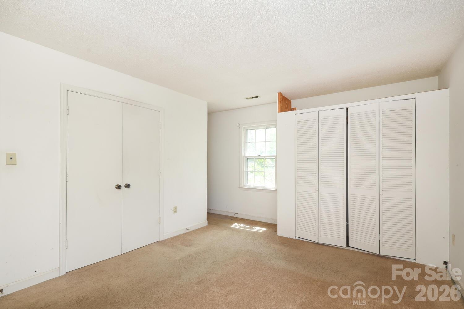 2000 Lawton Bluff Road Charlotte, NC 28226 - Photo 21 of 40 a view of an empty room with window