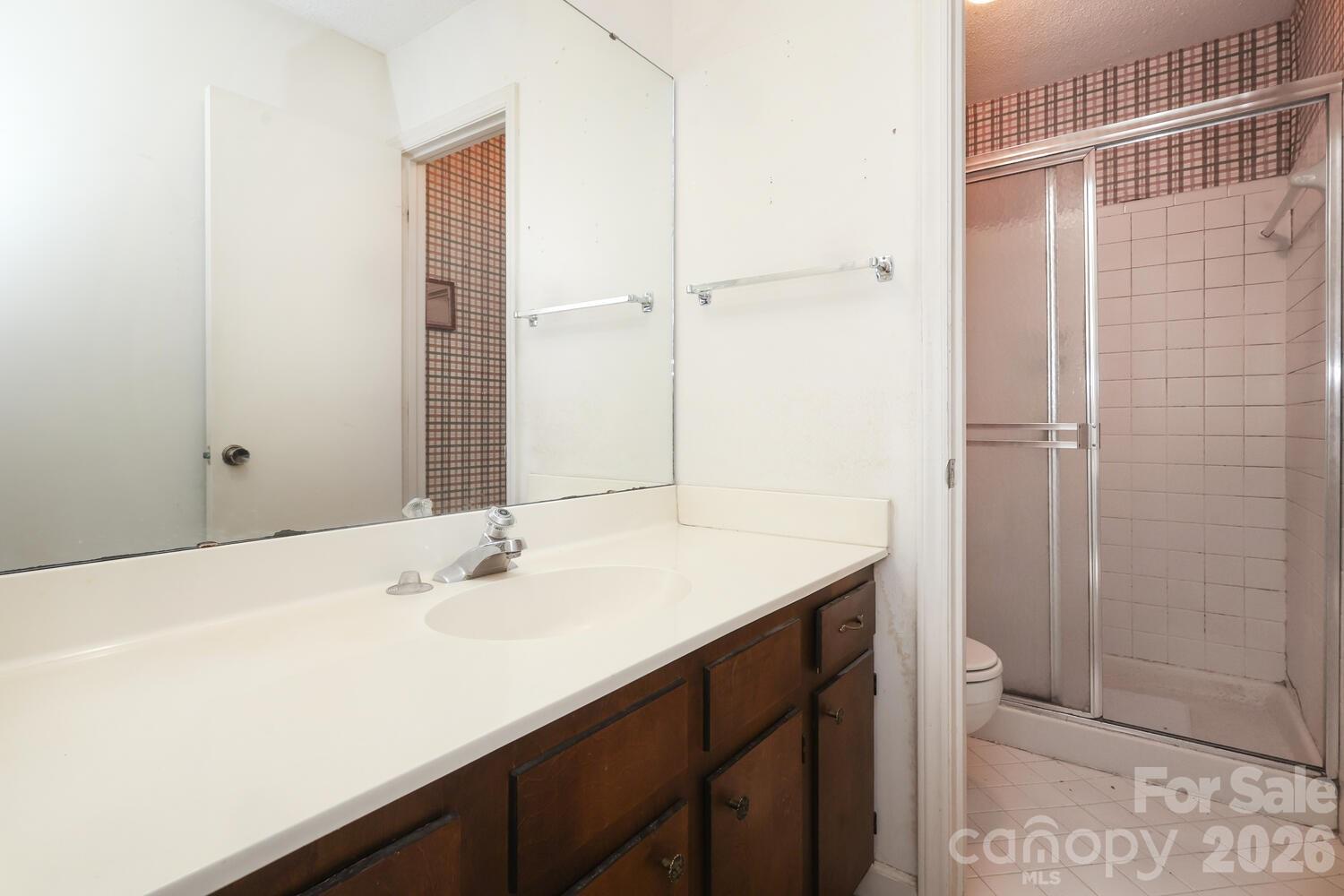2000 Lawton Bluff Road Charlotte, NC 28226 - Photo 22 of 40 a bathroom with a sink and a mirror
