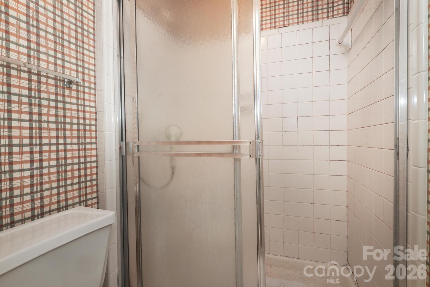 2000 Lawton Bluff Road Charlotte, NC 28226 - Photo 23 of 40 a bathroom with a sink a toilet and shower