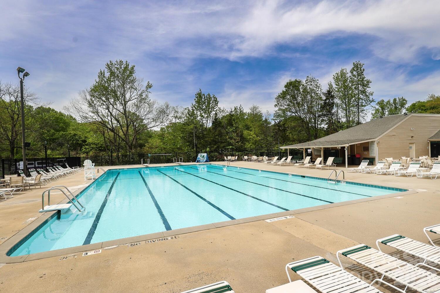 2000 Lawton Bluff Road Charlotte, NC 28226 - Photo 35 of 40 a view of a tennis ground with large trees