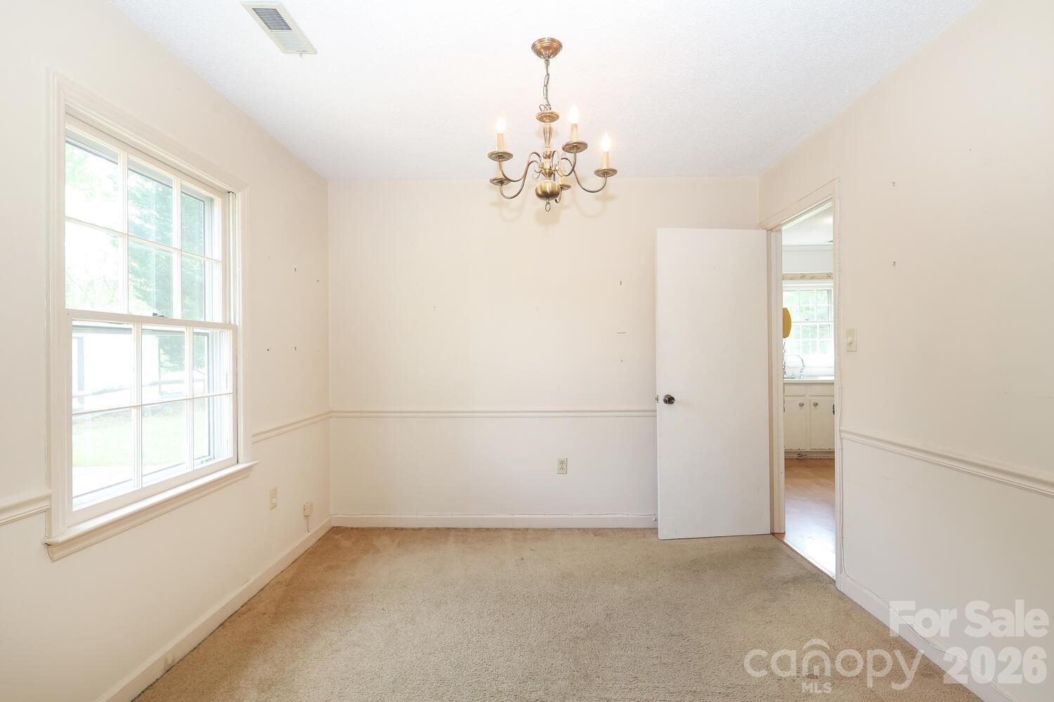 2000 Lawton Bluff Road Charlotte, NC 28226 - Photo 5 of 40 a view of a chandelier fan and windows