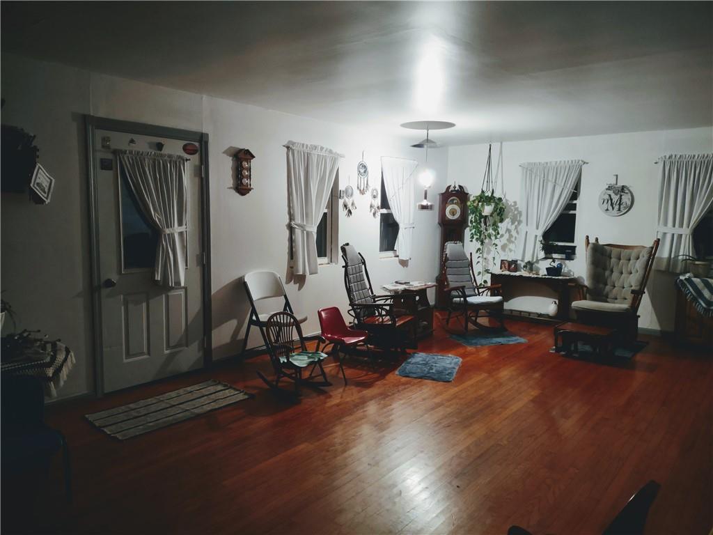 3325 Kennard Road Atlantic, PA 16111 - Photo 3 of 12 a living room with furniture hard wood floor and a flat screen tv