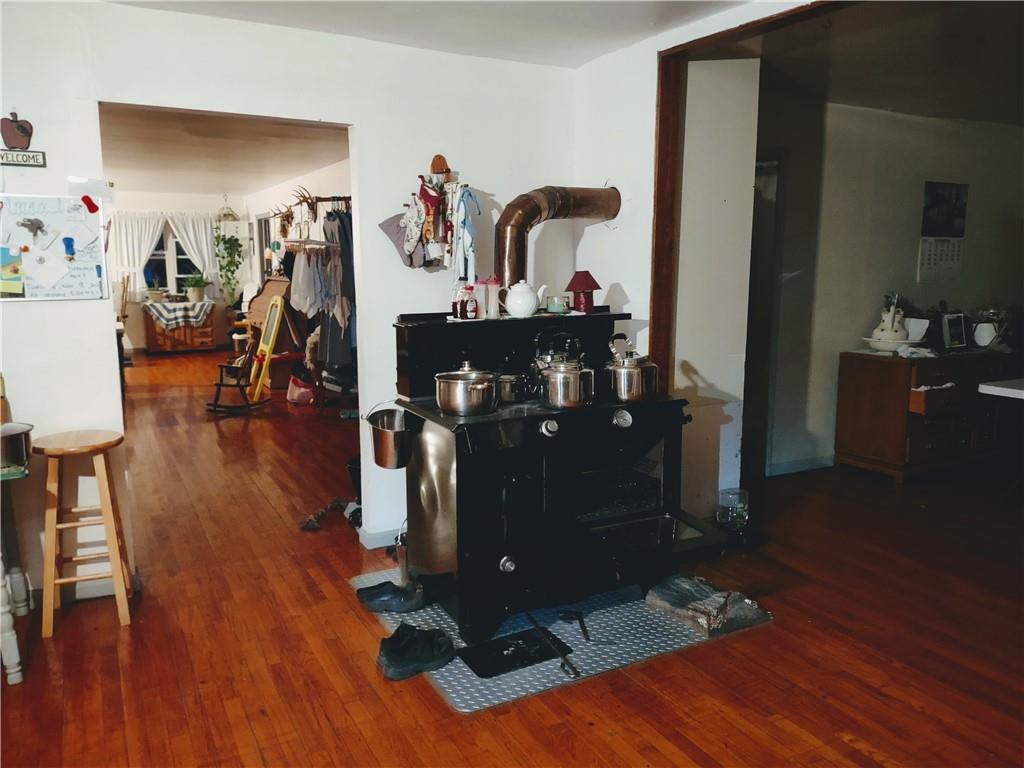 3325 Kennard Road Atlantic, PA 16111 - Photo 4 of 12 a living room with wooden floor furniture and a view of kitchen