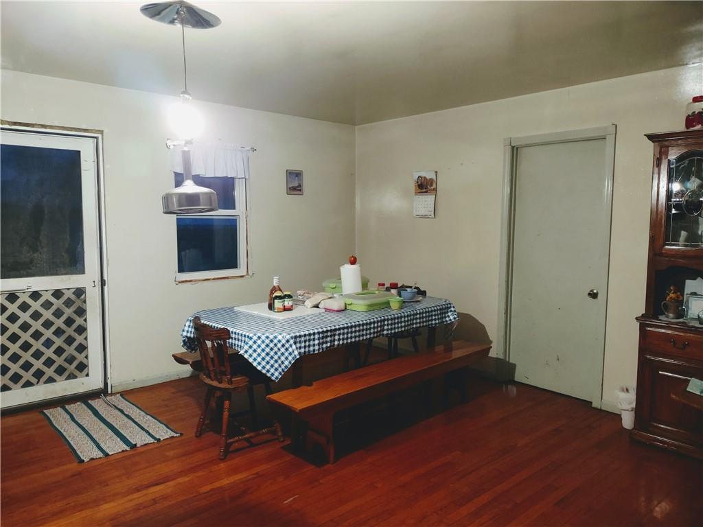 3325 Kennard Road Atlantic, PA 16111 - Photo 6 of 12 a room with wooden floor and furniture