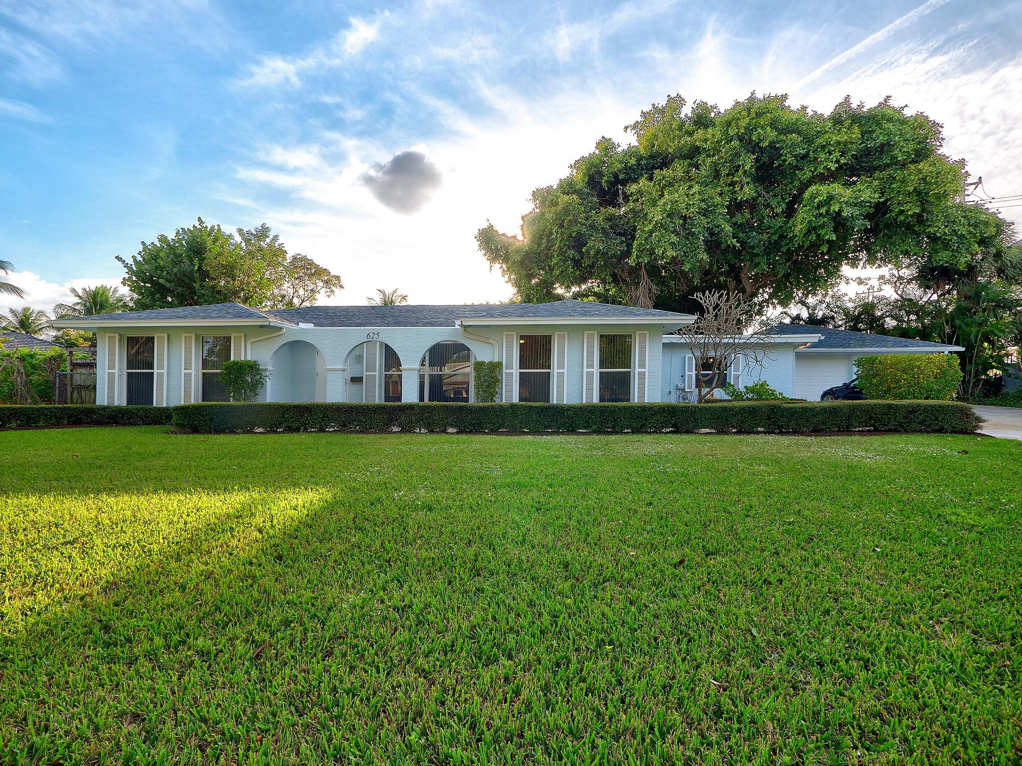 625 Atlantic Road North Palm Beach, FL 33408 - Photo 1 of 28 a view of a house with a yard deck and a tree