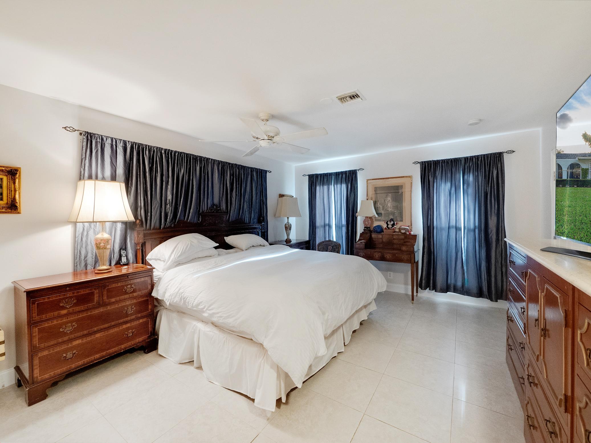 625 Atlantic Road North Palm Beach, FL 33408 - Photo 11 of 28 a bed room with a bed and a window