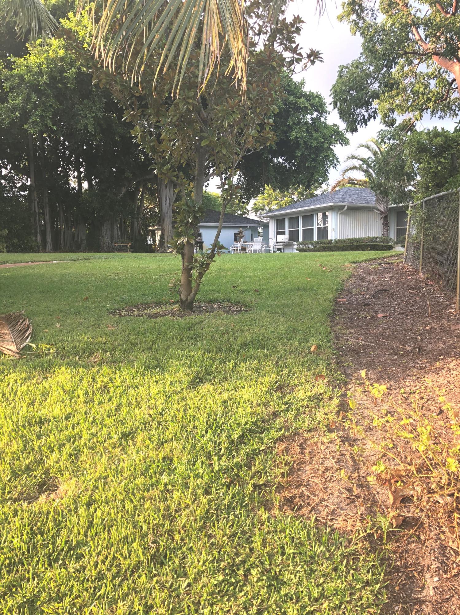 625 Atlantic Road North Palm Beach, FL 33408 - Photo 17 of 28 a view of a house with a yard