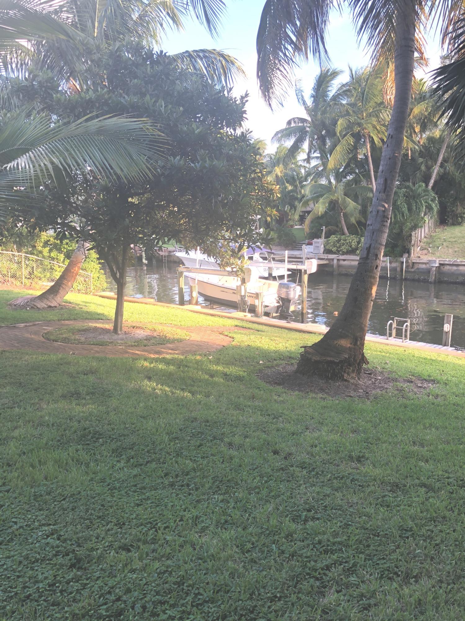 625 Atlantic Road North Palm Beach, FL 33408 - Photo 26 of 28 a view of a swimming pool with a yard
