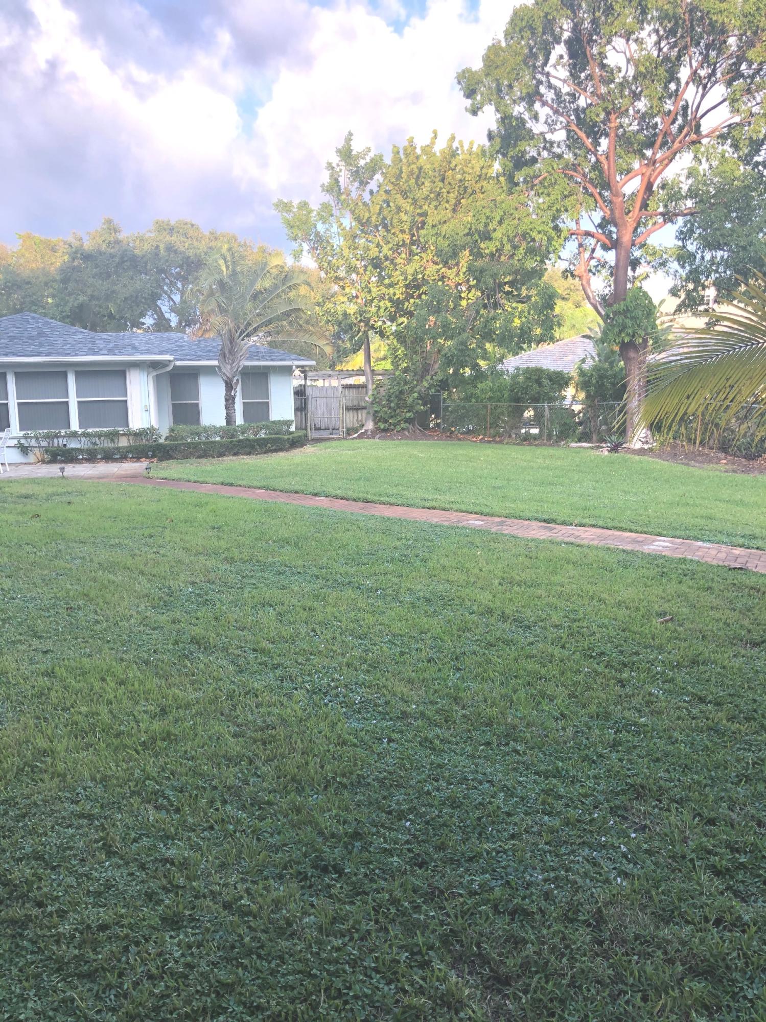 625 Atlantic Road North Palm Beach, FL 33408 - Photo 27 of 28 a view of a big yard with a large trees