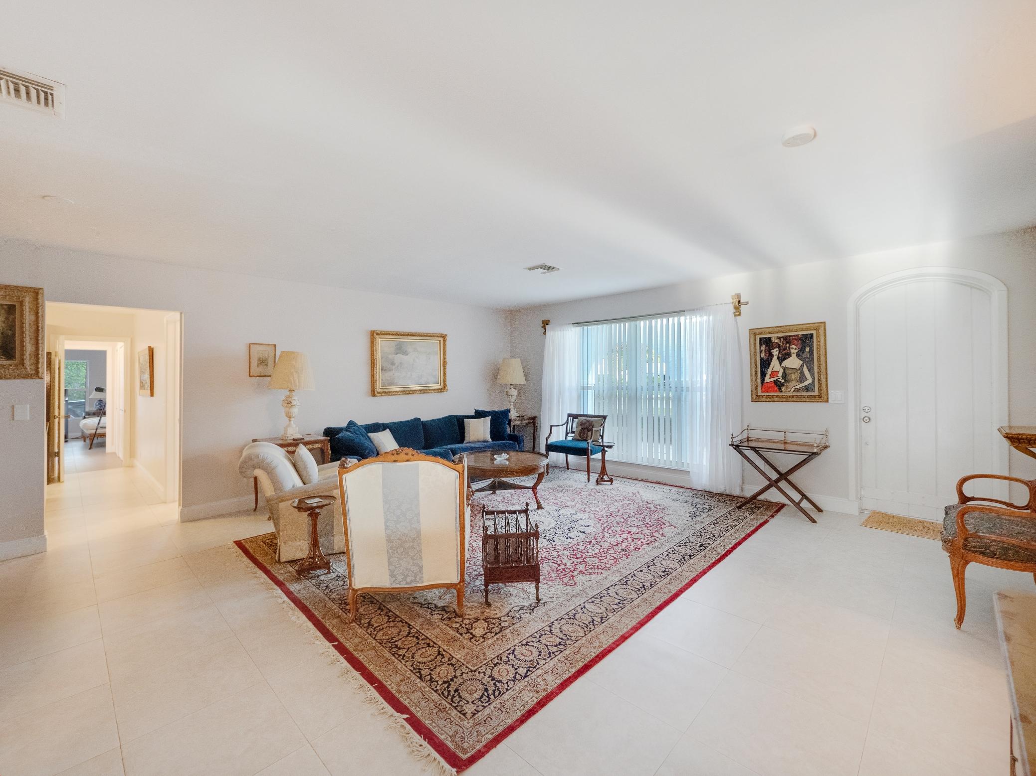 625 Atlantic Road North Palm Beach, FL 33408 - Photo 4 of 28 a living room with furniture a window and a table