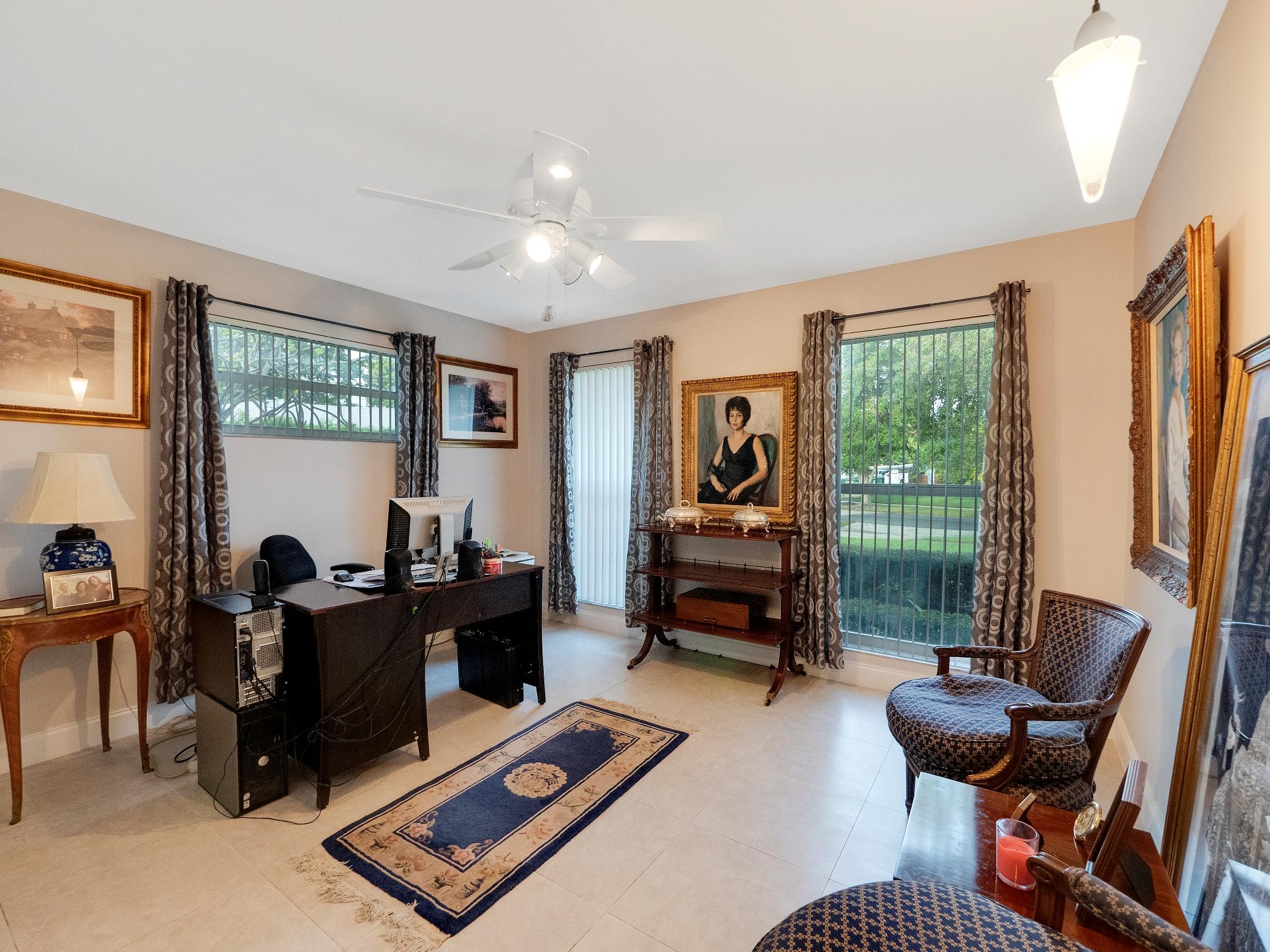 625 Atlantic Road North Palm Beach, FL 33408 - Photo 8 of 28 a living room with furniture gym equipment and a large window