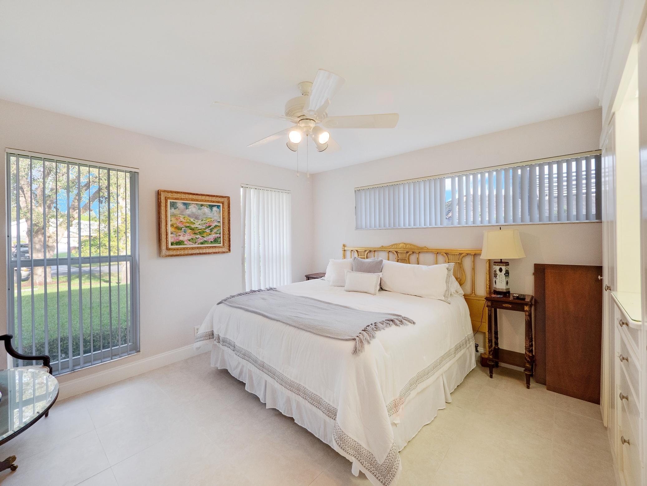 625 Atlantic Road North Palm Beach, FL 33408 - Photo 10 of 28 a bedroom with a bed and a window