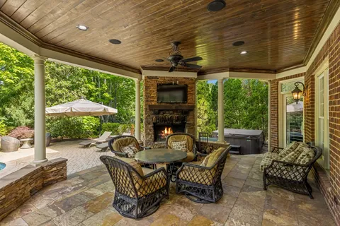 a view of a table and chairs under an umbrella