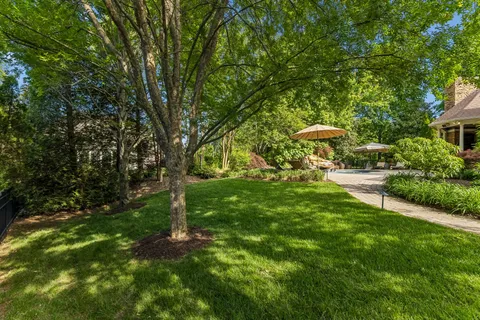 a view of house with a garden