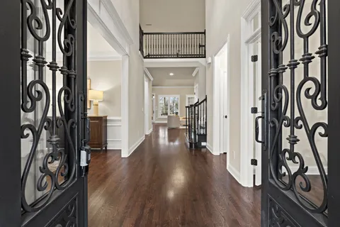 a view of an entryway with wooden floor