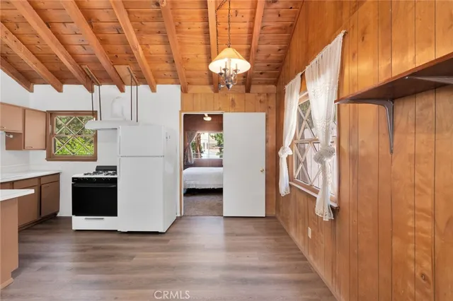 a view of a room with wooden floor and staircase