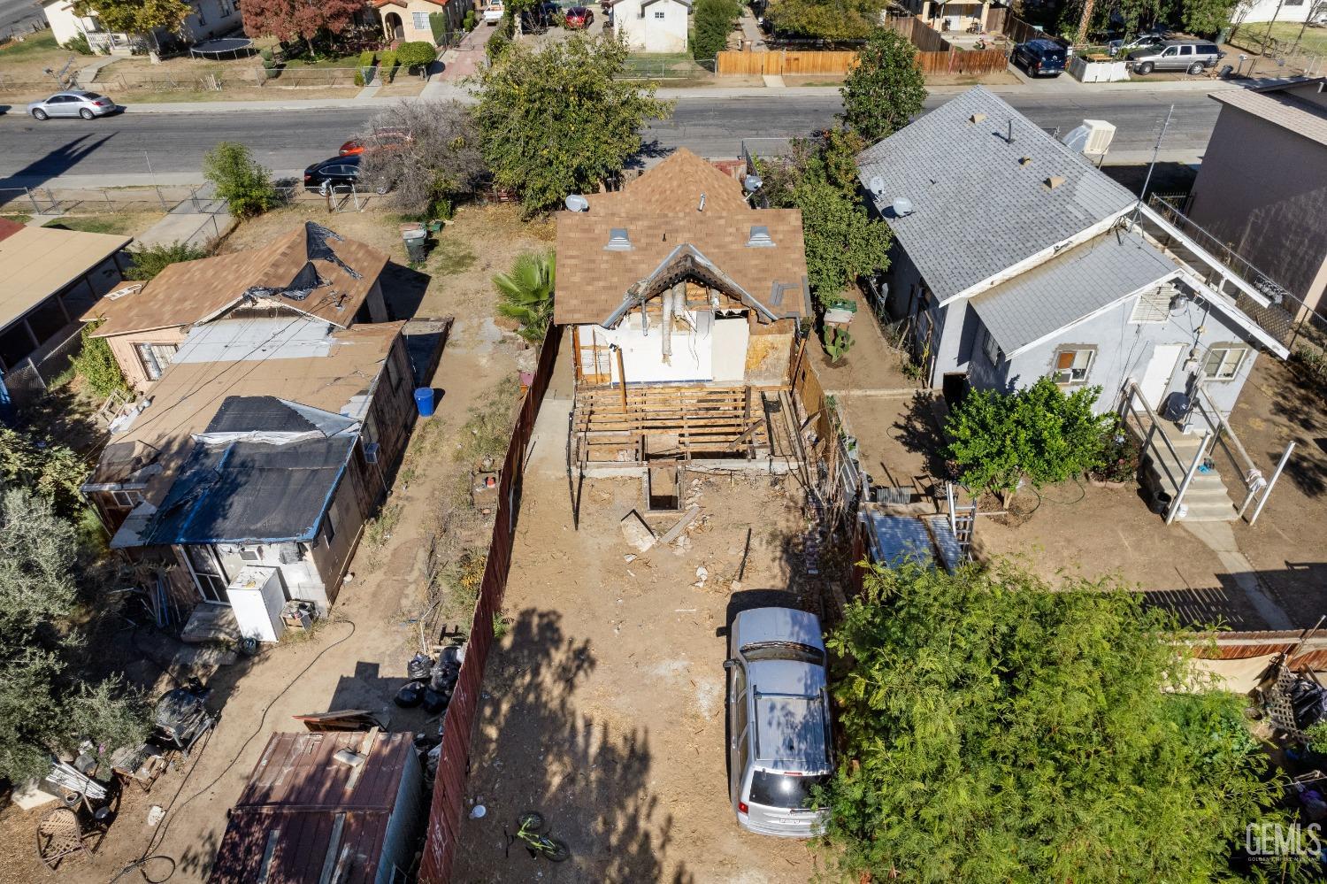 Undisclosed Address Bakersfield, CA 93305 - Photo 4 of 10 an aerial view of a residential apartment building with a yard