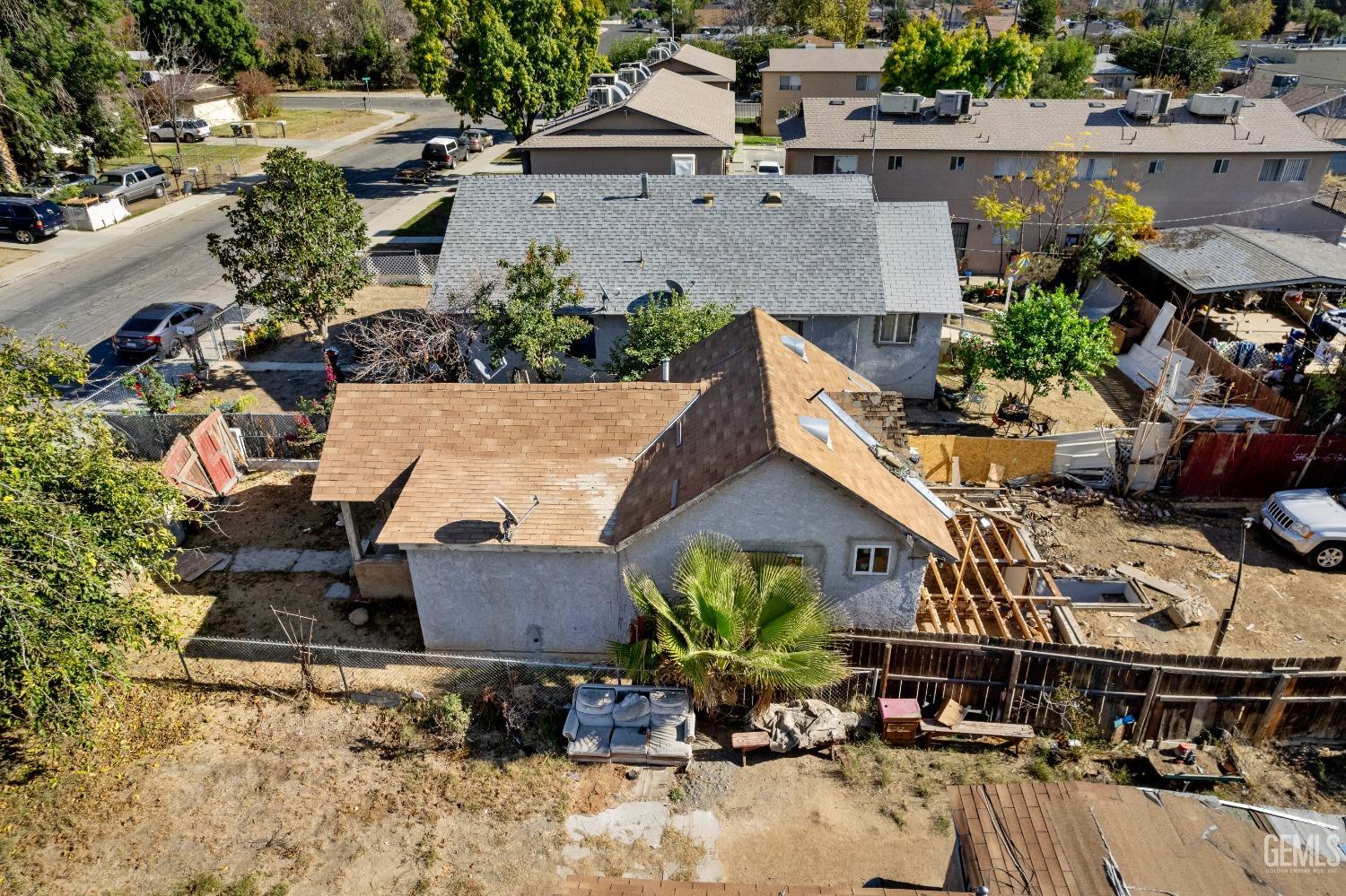 Undisclosed Address Bakersfield, CA 93305 - Photo 5 of 10 an aerial view of a house with a yard and lake view