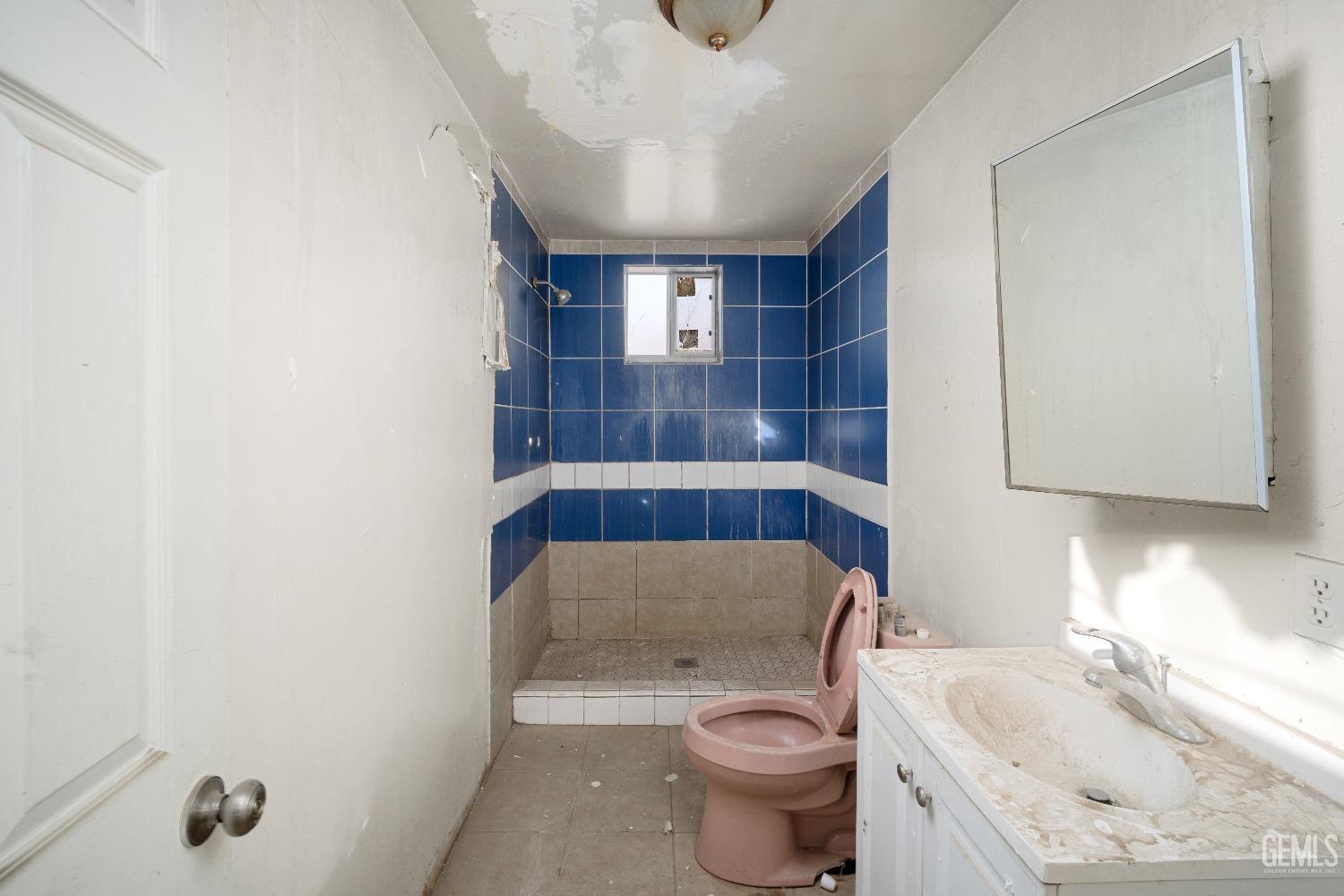 Undisclosed Address Bakersfield, CA 93305 - Photo 9 of 10 a bathroom with a sink toilet and shower