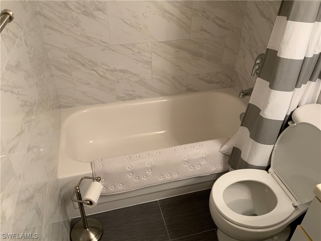 7055 New Post Road, Unit 5 North Fort Myers, FL 33917 - Photo 19 of 33 a bathroom with a toilet and a sink