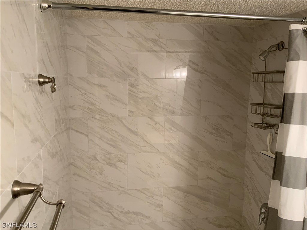 7055 New Post Road, Unit 5 North Fort Myers, FL 33917 - Photo 20 of 33 a bathroom with a shower