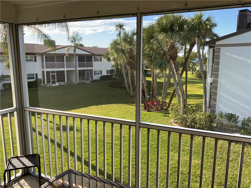 7055 New Post Road, Unit 5 North Fort Myers, FL 33917 - Photo 3 of 33 a view of a large window with a small yard