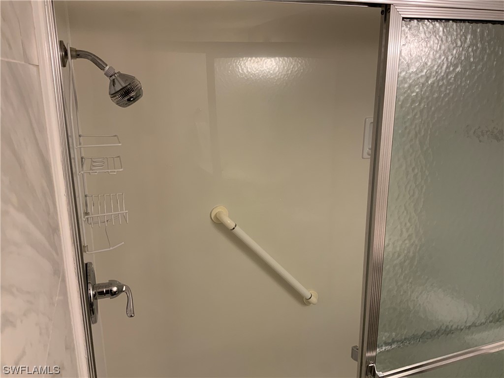 7055 New Post Road, Unit 5 North Fort Myers, FL 33917 - Photo 10 of 33 a bathroom with a shower