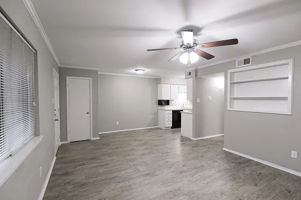 a view of a kitchen with a sink and a kitchen view