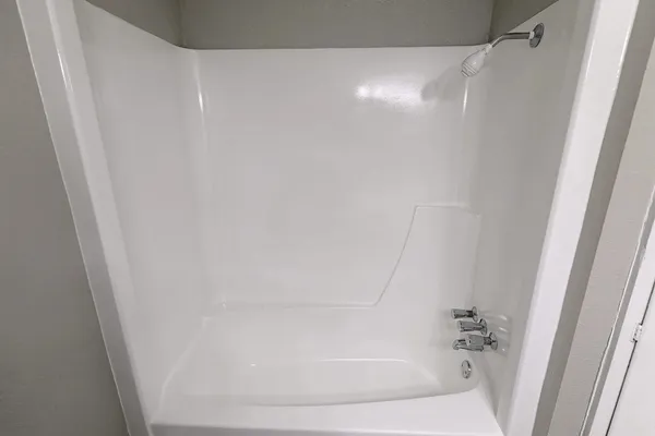 a close view of a bathtub in bathroom