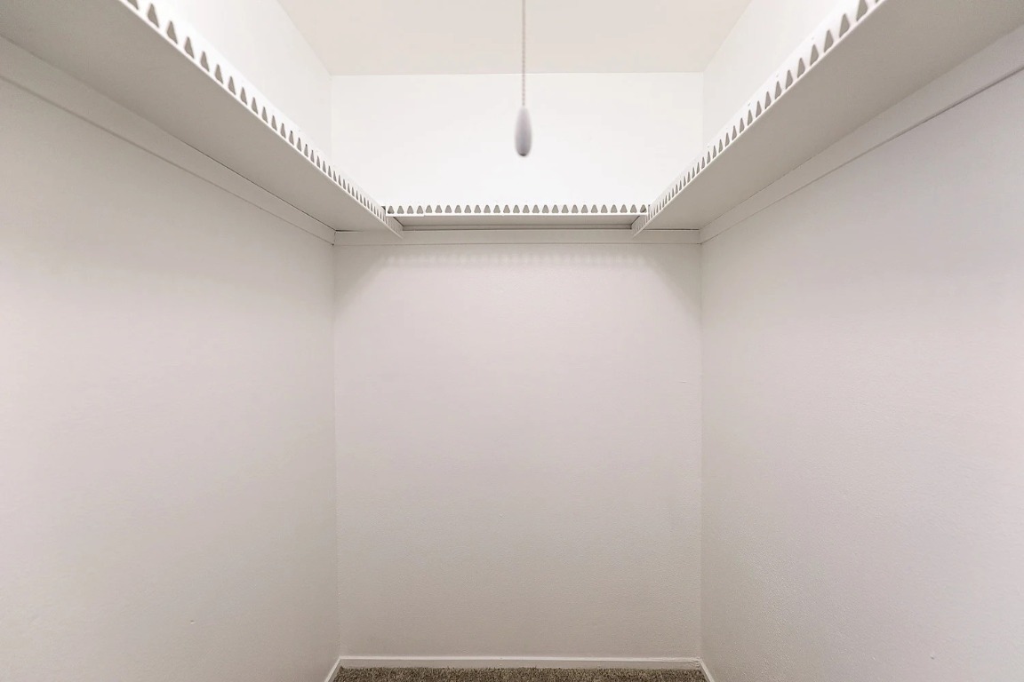 8100 North Mopac Expressway, Unit 2107 Austin, TX 78759 - Photo 22 of 23 Spacious closet with carpet